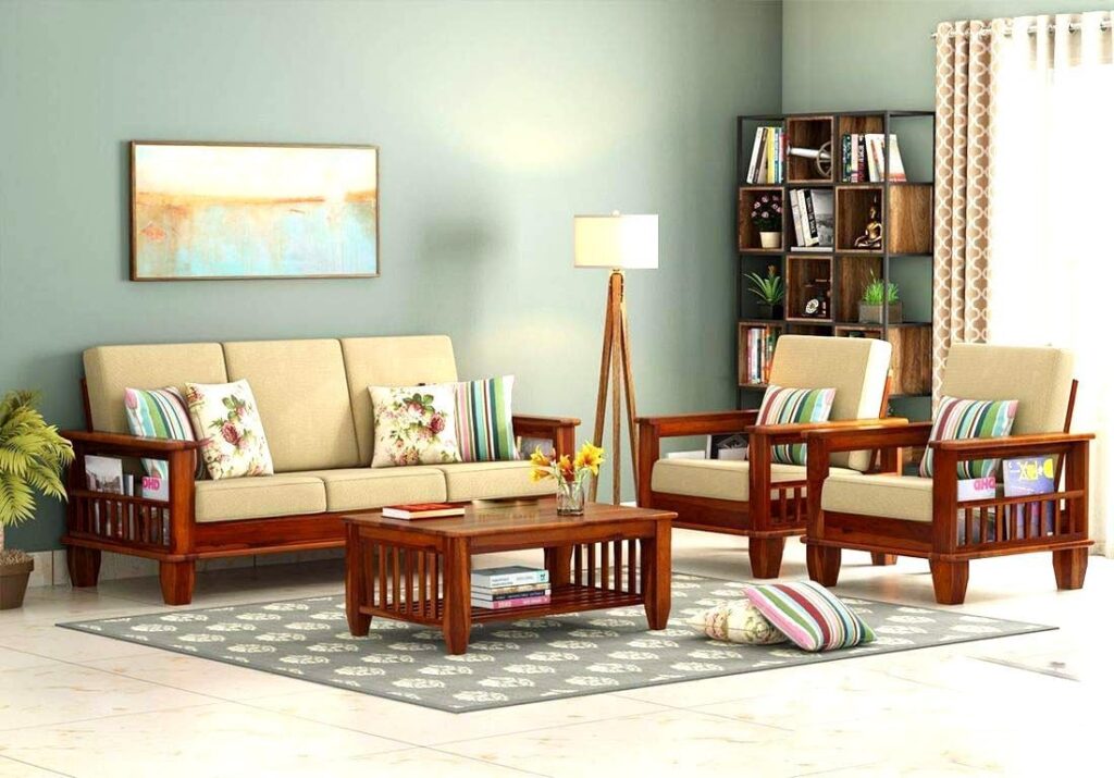 Upgrade your home with Mamta Furniture’s solid Sheesham wood 5-seater sofa set. Elegant teak finish, cream cushions & 10-year termite warranty included.